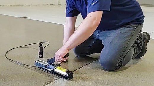 Technician using an adhesion tester